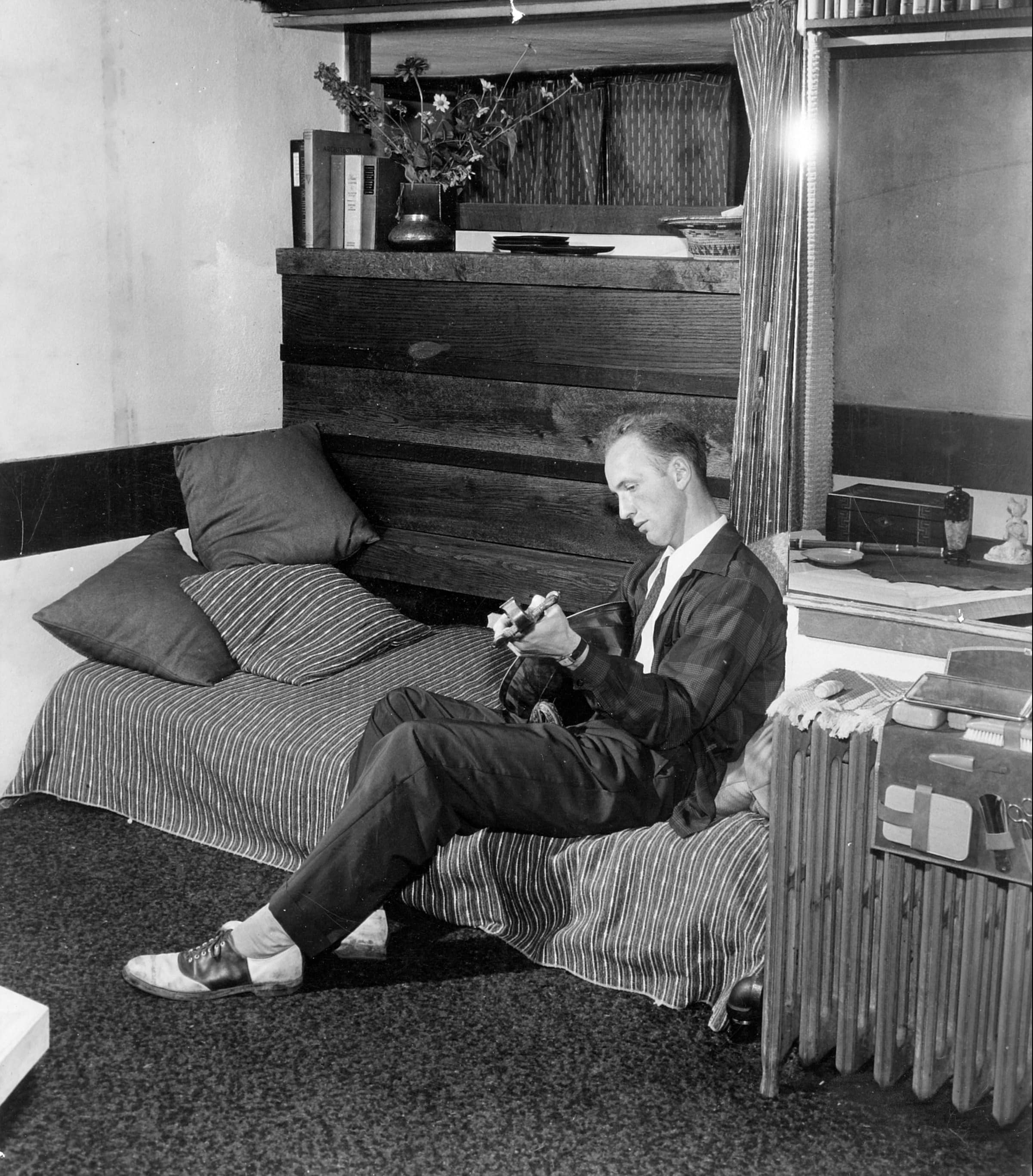 Apprentice John Hill in Hillside Corridor room, perhaps playing a mandolin.