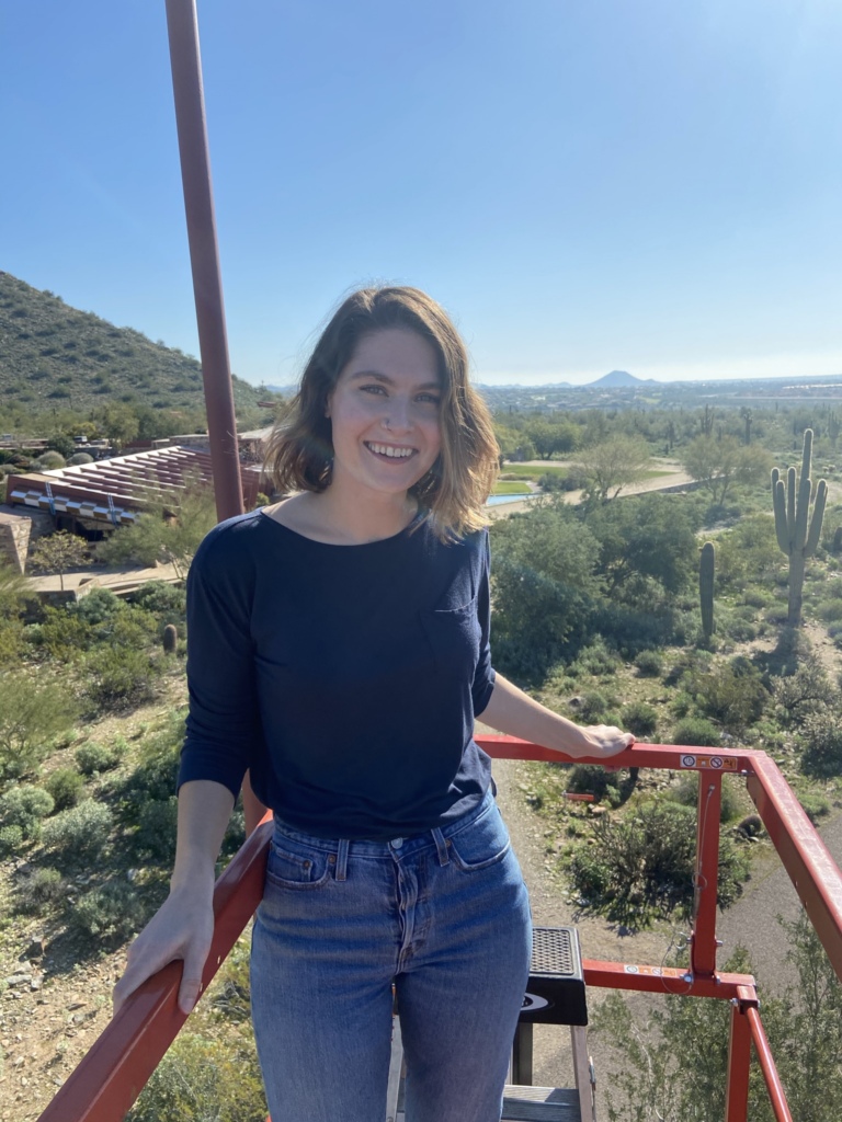 Rachel Minier on a lift, Taliesin West in the background