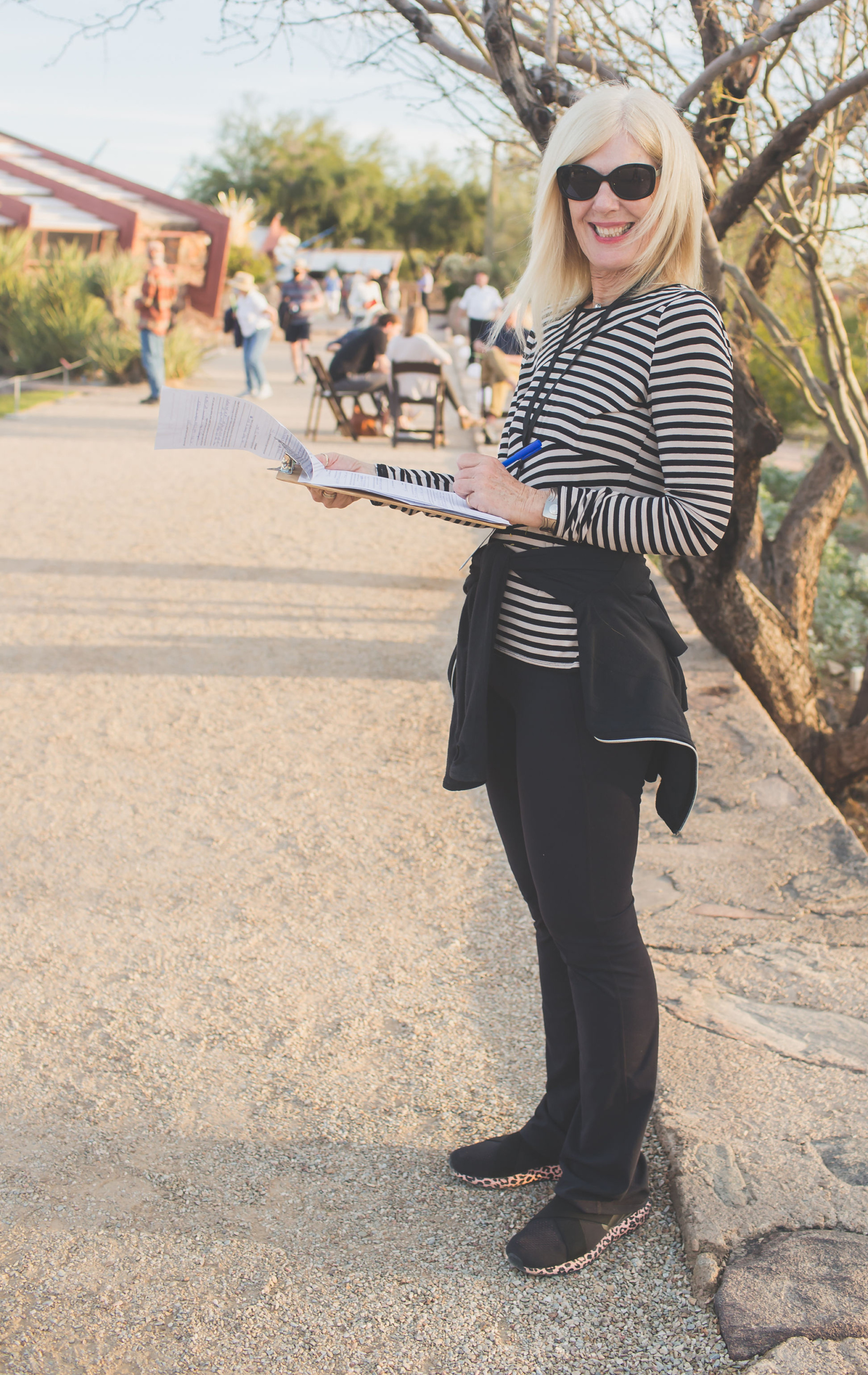 volunteer with clipboard outside